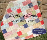 Finished throw size quilt made with Stepping Stones pattern, using colorful layer cakes in squares and blocks, from Kristin Blandford Designs.