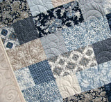 Easy throw quilt pattern using Stepping Stones PDF – designed for 10" layer cake precuts, from Kristin Blandford Designs.