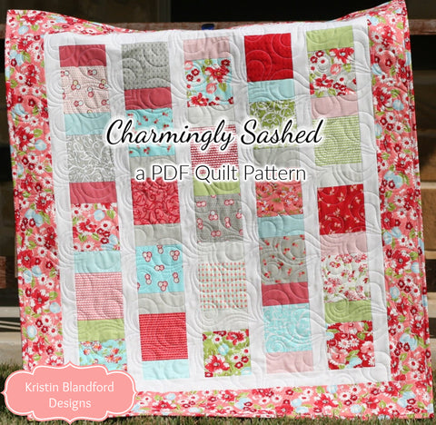Charmingly Sashed quilt pattern PDF by Kristin Blandford Designs featuring a beginner-friendly charm pack quilt design with colorful floral patchwork fabrics and crisp white sashing