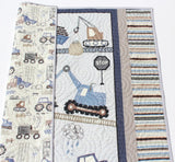 truck baby quilt handmade by Kristin Blandford Designs featuring construction vehicles for boy nursery decor and baby bedding