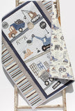 construction themed baby quilt with dump trucks excavators and cranes handmade by Kristin Blandford Designs for nursery bedding