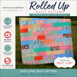 Modern throw quilt pattern with colorful horizontal strips and floral fabrics designed for beginner-friendly quilting and fast sewing.