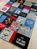 Quilt from shirts laid out in modern block design

