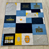 Graduation gift quilt with college and high school shirts