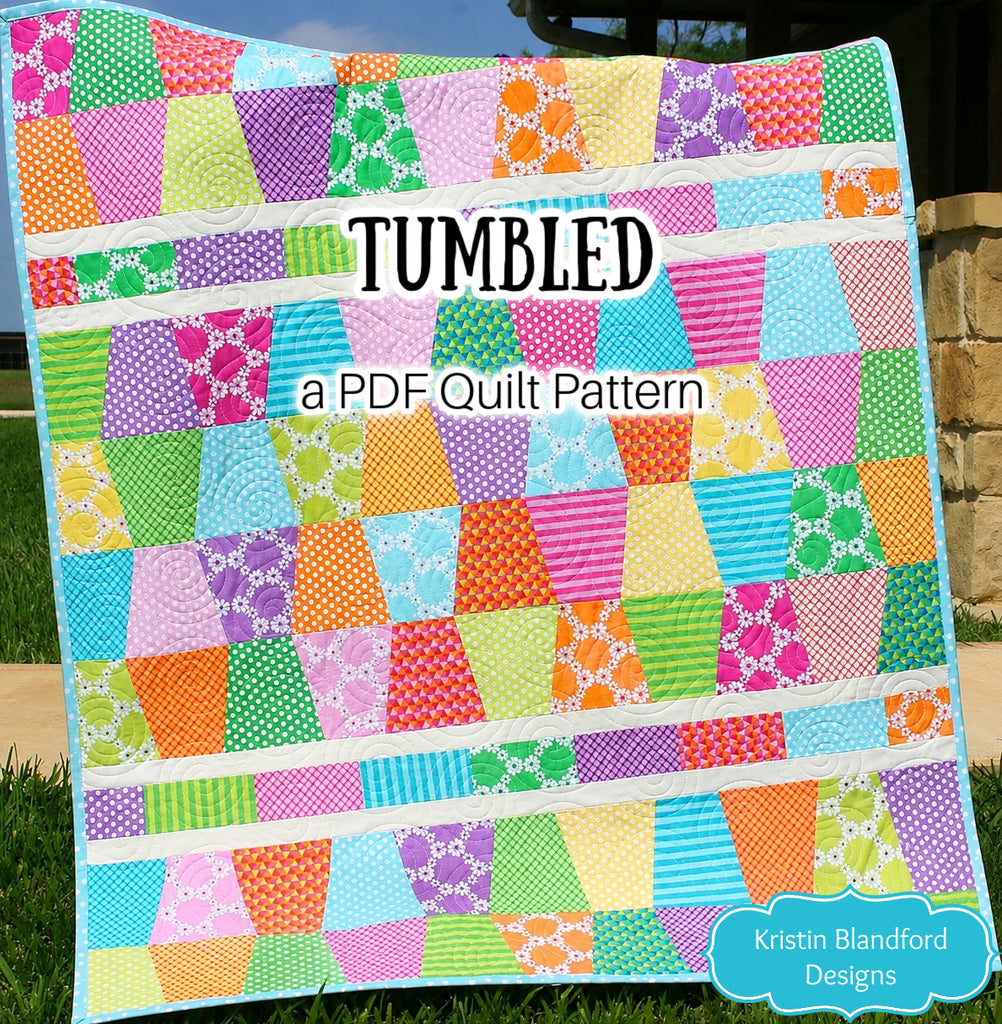 Beginner friendly Tumbled quilt pattern PDF download for baby quilts and lap quilts featuring a bright geometric tumbling block design created with 5 inch charm pack squares. This modern quilt pattern by Kristin Blandford Designs is ideal for colorful fabric collections, stash busting, precut quilting fabric, and easy handmade quilt gifts.