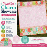 Easy Tumbler Charm Showcase quilt pattern by Kristin Blandford Designs showcasing a fun patchwork tumbler border layout combined with decorative quilting details and modern quilt styling. This PDF quilt pattern allows quilters to feature favorite fabrics, florals, novelty prints, and colorful charm packs in a beginner friendly project.