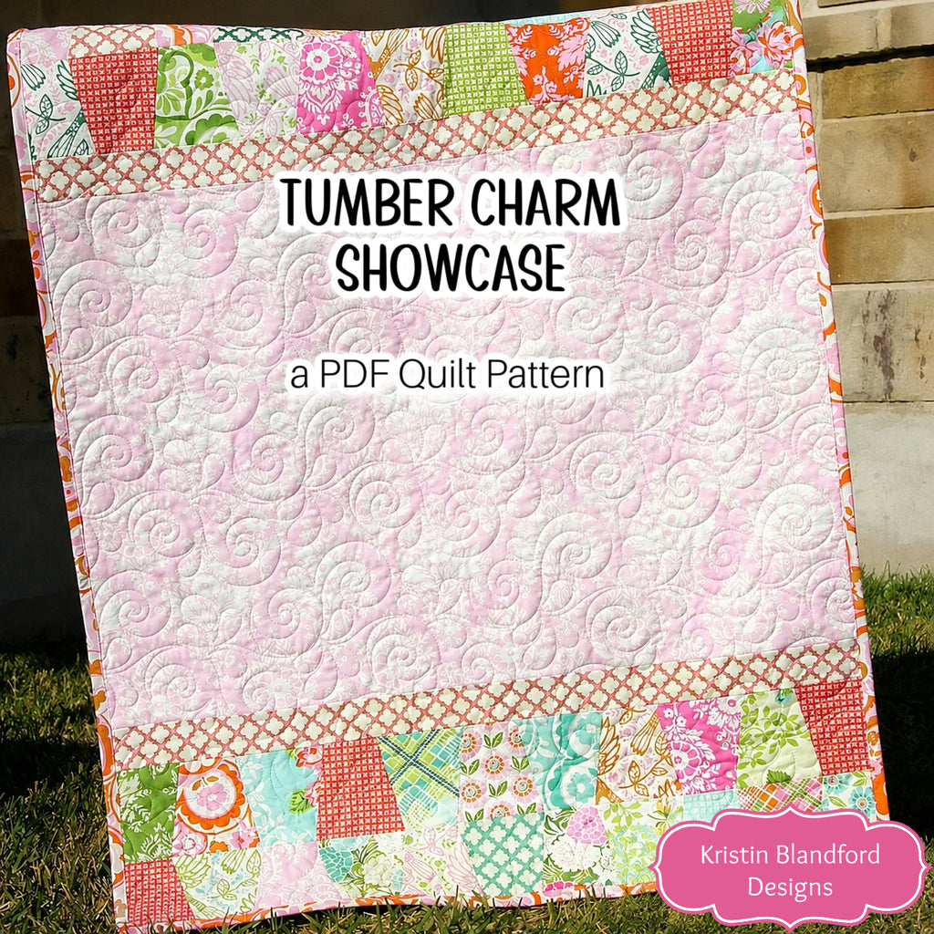 Tumbler Charm Showcase quilt pattern image featuring playful tumbler patchwork borders and a softly quilted framed center design that highlights the movement and shape of tumbler quilt blocks. This beginner friendly PDF quilt pattern by Kristin Blandford Designs is perfect for charm squares, pre cuts, and modern quilting projects.