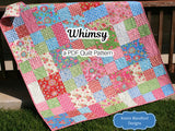Whimsy Quilt Pattern by Kristin Blandford Designs featuring a beginner friendly patchwork quilt layout designed for layer cakes and 10 inch pre cut fabric squares. This modern PDF quilt pattern creates beautiful baby quilts and throw quilts with easy piecing and a timeless patchwork design perfect for beginners and experienced quilters alike.