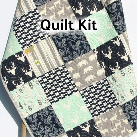 woodland deer baby quilt kit with mint and navy fabrics featuring buck deer forest nursery design