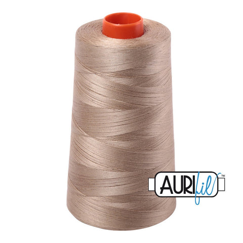Aurifil 2325 Linen MAKO 50wt cotton quilting thread 5900m cone for piecing, quilting, binding, sewing, machine quilting, longarm quilting, quilt kits, baby quilts, throw quilts, neutral fabrics, cream fabrics, beige fabrics, warm backgrounds, and patchwork sewing projects from Kristin Blandford Designs.