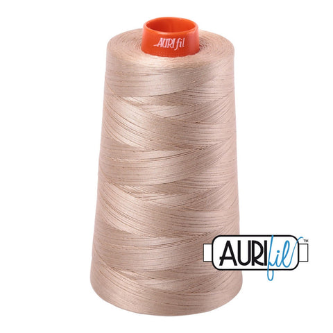 Aurifil 2326 Sand MAKO 50wt cotton quilting thread 5900m cone for piecing, quilting, binding, sewing, machine quilting, longarm quilting, quilt kits, baby quilts, throw quilts, neutral fabrics, tan fabrics, beige fabrics, warm backgrounds, and patchwork sewing projects from Kristin Blandford Designs.