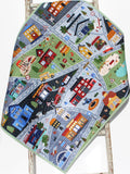 City street quilted play mat featuring hospital, fire station, gas station, and vehicles, ideal floor nursery blanket.
