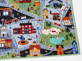Personalized transportation blanket with roads, police car, school, airport motifs; safe, durable cotton quilted construction.