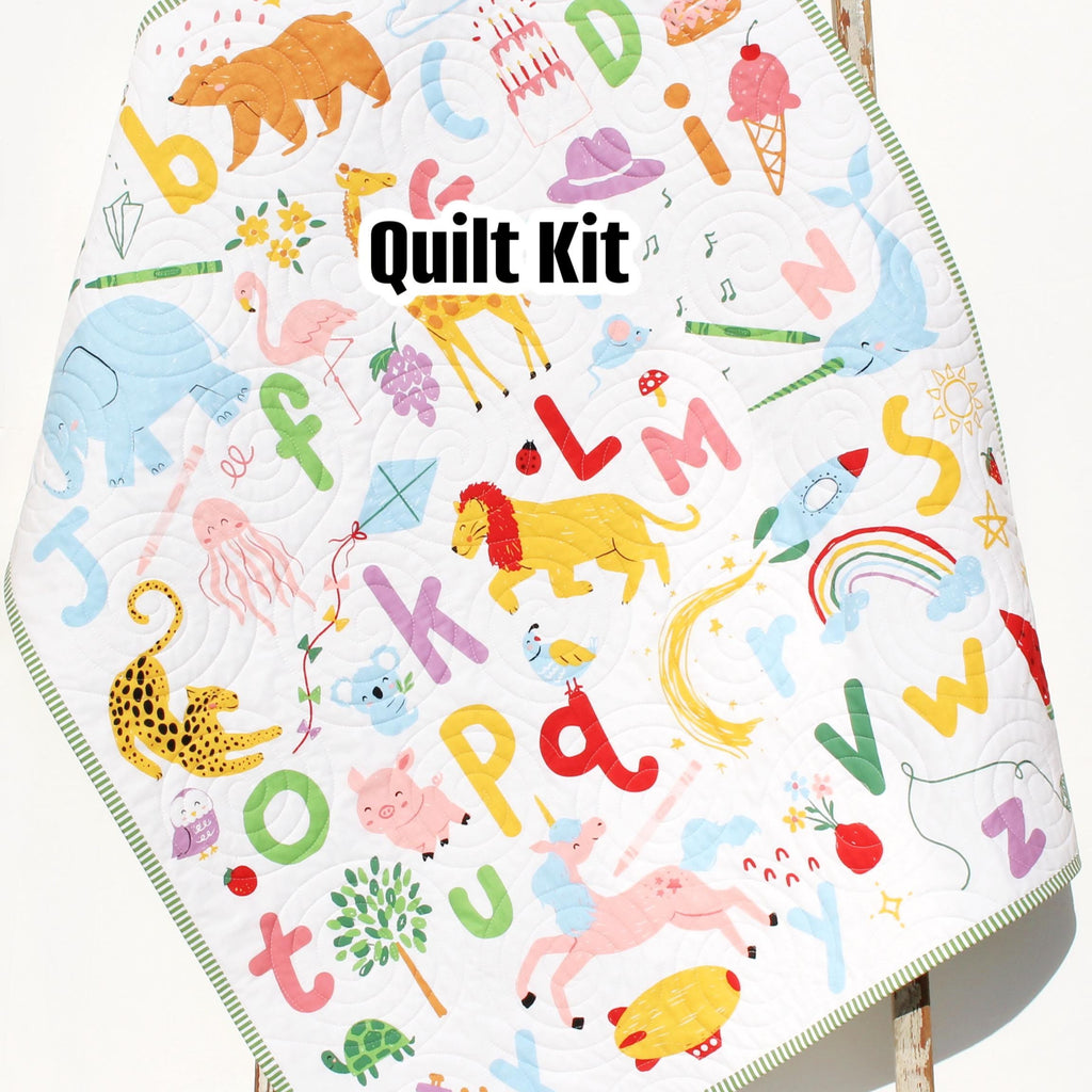 Bright ABC quilt panel kit with alphabet letters, crayon doodles, binding and backing included for learning blanket project.