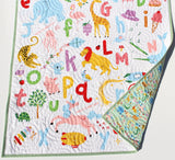 Personalized alphabet quilt handmade with embroidered details, colorful animal letters A to Z, unique newborn or toddler blanket.