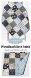Rustic navy woodland baby quilt kit for sewing, including coordinated fabrics with deer, owls, and lodge-style prints.