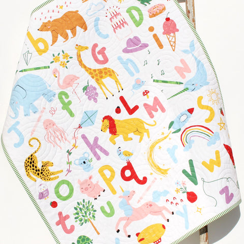 Colorful ABC animal baby quilt with embroidered name, handmade cotton blanket featuring letters and animals for nursery décor.