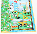 Construction zone nursery blanket kit with “Dream Big” message, vehicle panel, and striped yellow binding included.