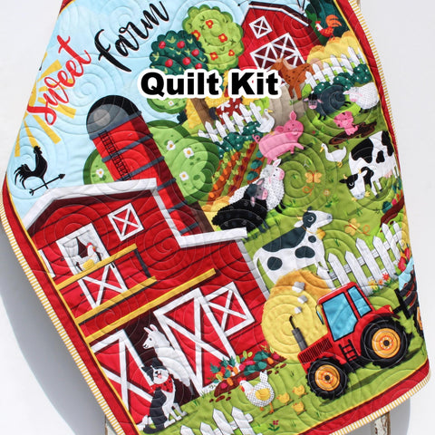 Farmyard panel quilt kit with red barn, tractors, and friendly farm animals, including binding and backing for baby gift sewing.