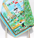Truck and digger quilt panel kit with vibrant “Dream Big” design, yellow stripe trim, and premium fabrics.
