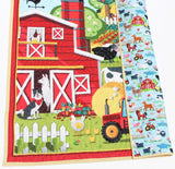 Personalized barn-and-animals quilt, handmade, embroidered name on front, ideal keepsake for babies or toddlers.