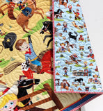 Custom cowboy quilt for babies embroidered with child’s name or birthdate, handmade with premium cotton fabrics and western designs.