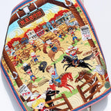 Handmade personalized cowboy baby quilt with embroidered name, featuring rodeo cowboys, horses, and rustic Wild West fabric prints.