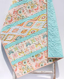 Crib size quilted baby blanket for stroller rides, tummy time, and nursery décor