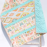 Butterfly Posy crib blanket quilt with floral butterfly prints in soft pastel nursery colors