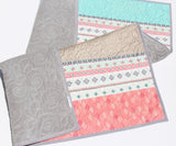 DIY nursery quilt sewing kit featuring pink and mint green striped fabrics