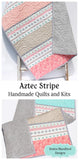 Nursery bedding quilt with simple striped design