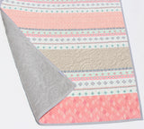 Baby quilt blanket with striped fabric layout and soft colors