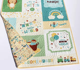 Personalized baby quilt with embroidered name designed as a keepsake nursery blanket