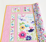 Butterfly fabric panel quilt with pink floral borders and beginner friendly design