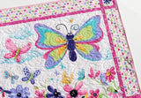 Panel based butterfly quilt kit designed for a baby playroom floor quilt