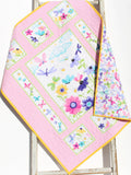Custom name embroidered quilt with butterfly and floral artwork