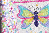 Baby activity mat quilt with butterflies and bright floral artwork