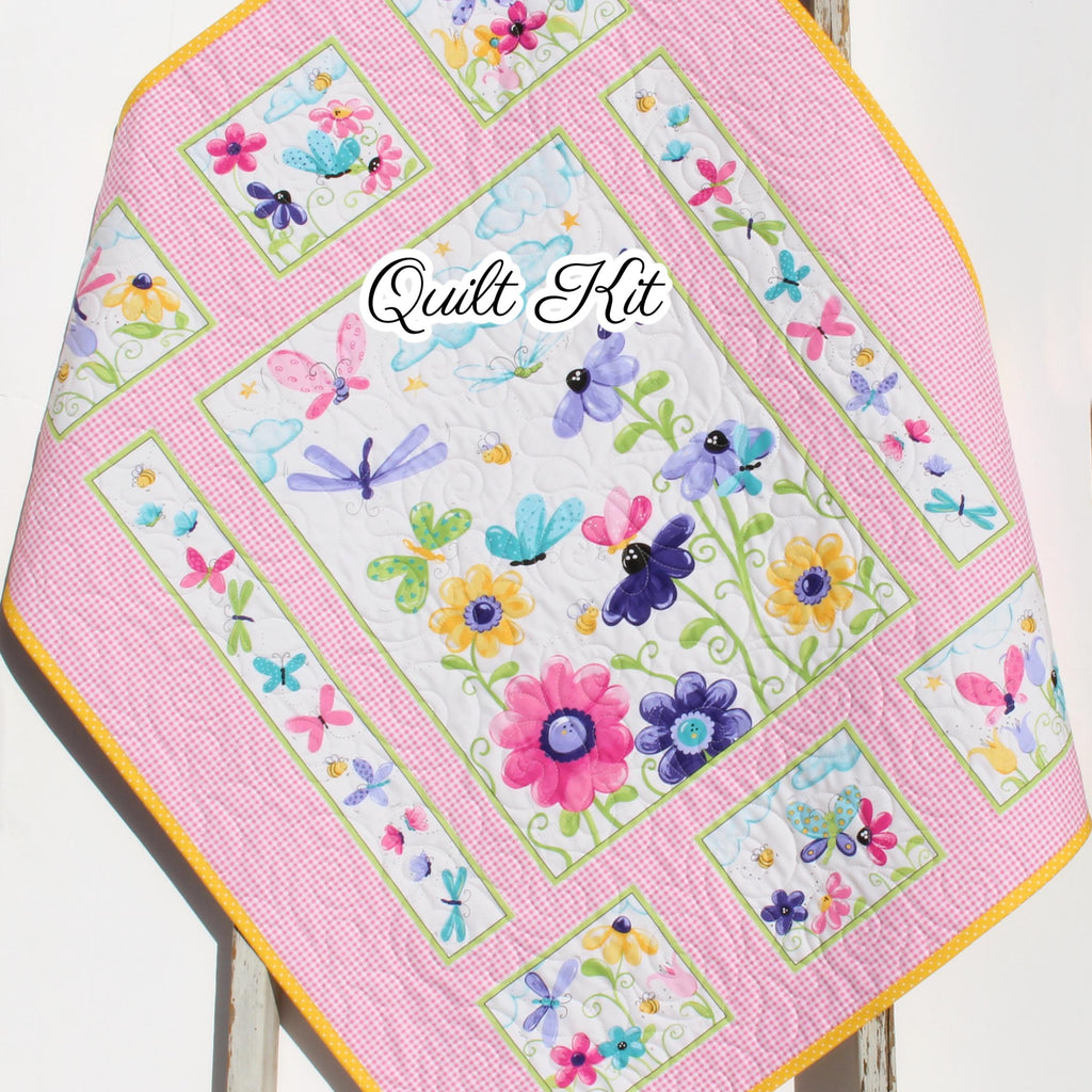 Pink butterfly quilt panel kit featuring floral fabrics for a handmade baby quilt sewing project