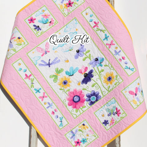 Pink butterfly quilt panel kit featuring floral fabrics for a handmade baby quilt sewing project