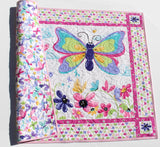 Handmade baby play mat quilt created using a butterfly fabric panel