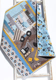 beginner friendly baby quilt kit with construction theme fabric including trucks and equipment for boys nursery sewing project